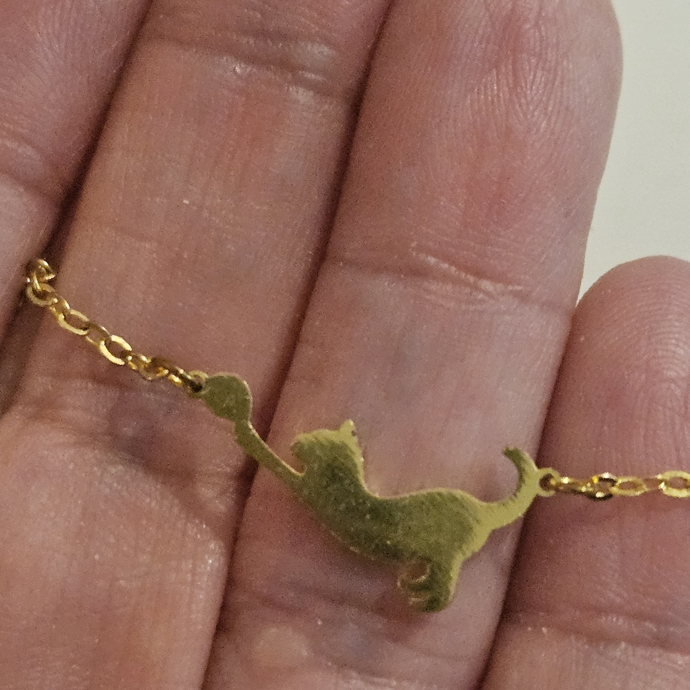 Item 800 Gold Cat Chasing Yarn Pendant Necklace